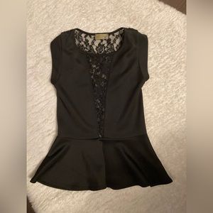 Black peplum top with lace inlay on chest and back